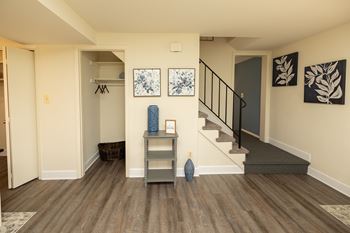 A hallway with a staircase